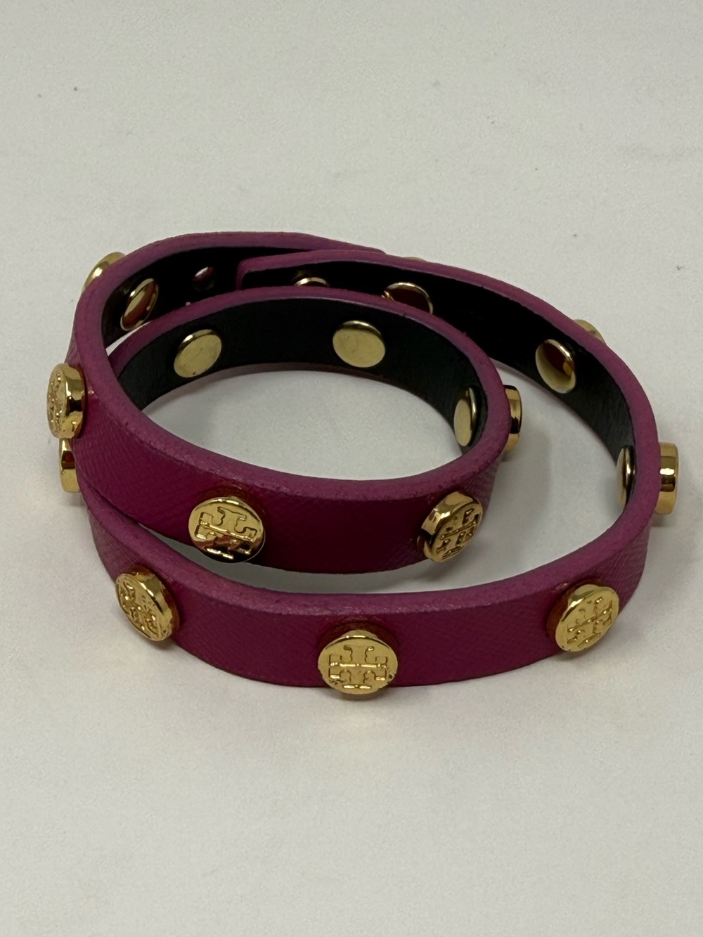 Magenta Tory Burch double-wrap leather bracelet accented with gold-tone logo